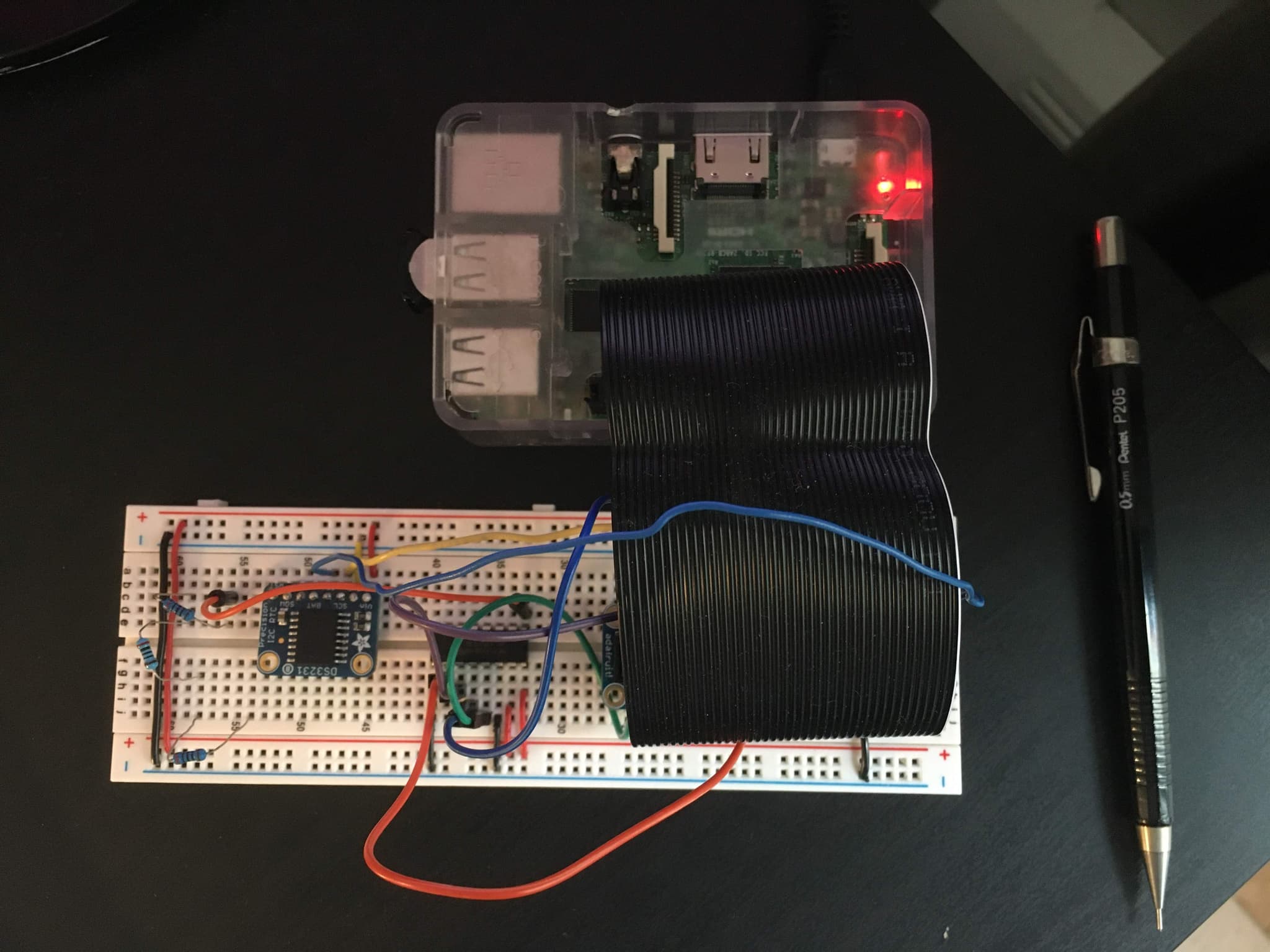 The circuit laid out on a breadboard with a Raspberry Pi